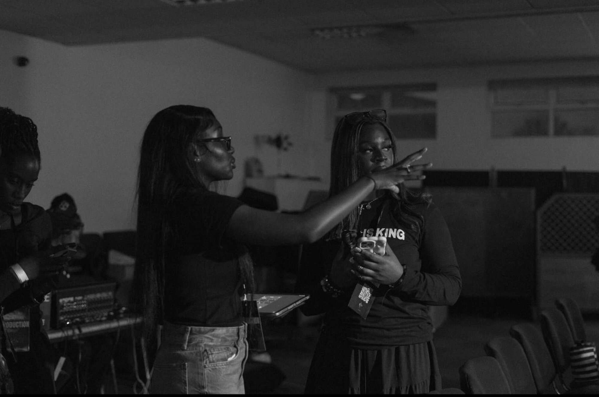 Black-and-white photo of the KAN Birmingham production team at work.