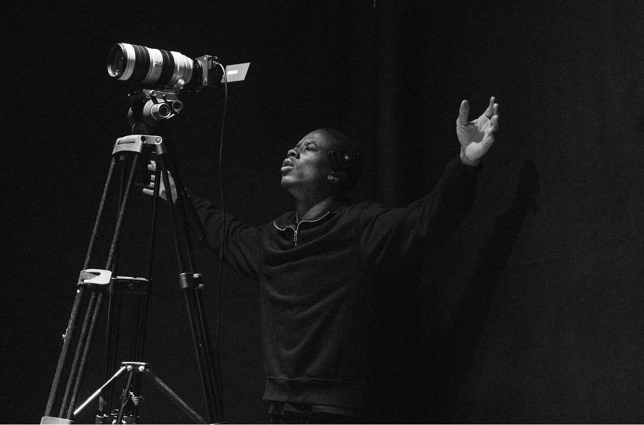 A videographer filming a Sunday service