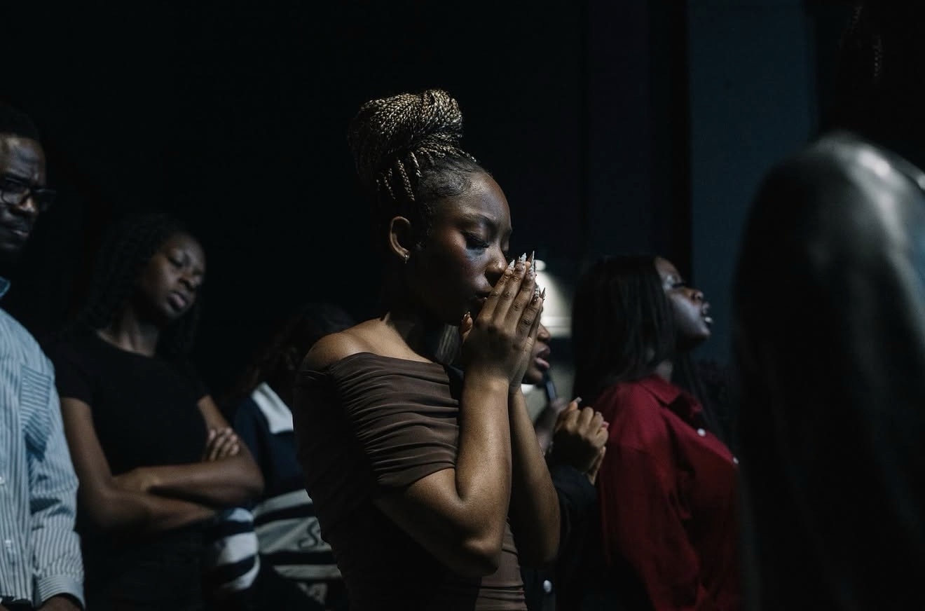 A bowed head in quiet prayer